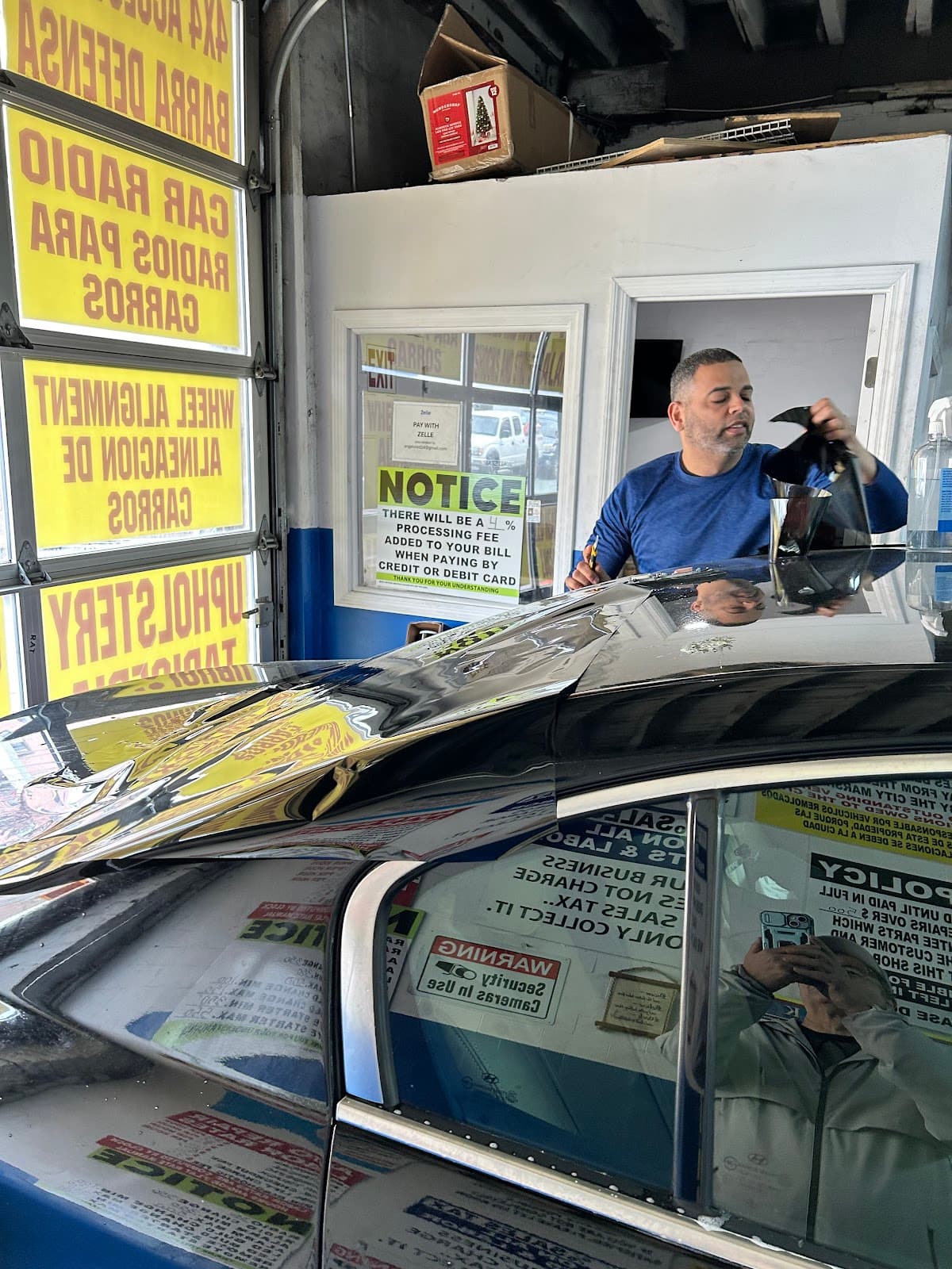 Window tint being applied to a car